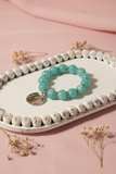 Teal Acrylic Beaded Bracelet With Golden Dangly Charm
