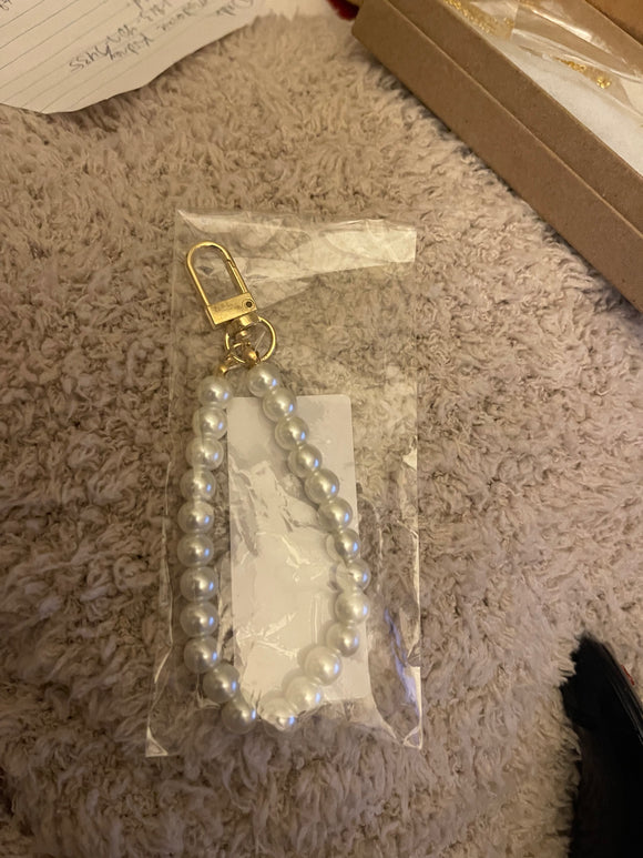 Pearl bracelet with a charm or purse charm