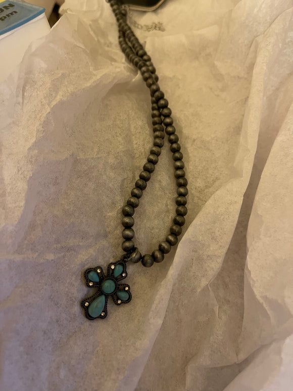 Silver Necklace With A Turquoise Cross