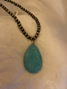 Oval Turquoise Pendant With A Sliver Necklace