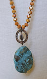 Turquoise Stone With Orange Beads