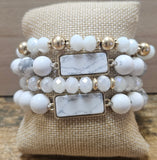 Four Piece White And Gold Beads With White Howlite Pendants.