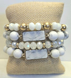 Four Piece White And Gold Beads With White Howlite Pendants.